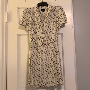 White dress with blue floral detail